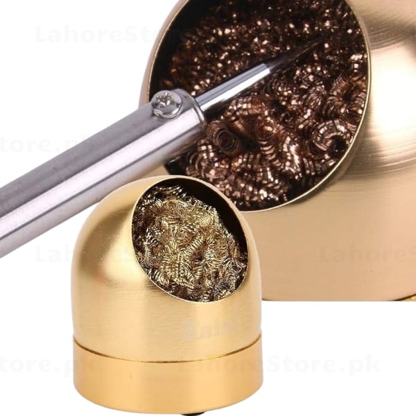 Soldering iron tip being cleaned in brass wire ball cleaner