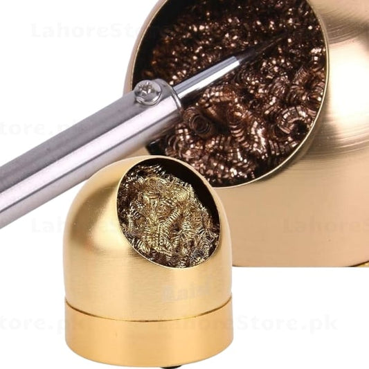 Soldering iron tip being cleaned in brass wire ball cleaner