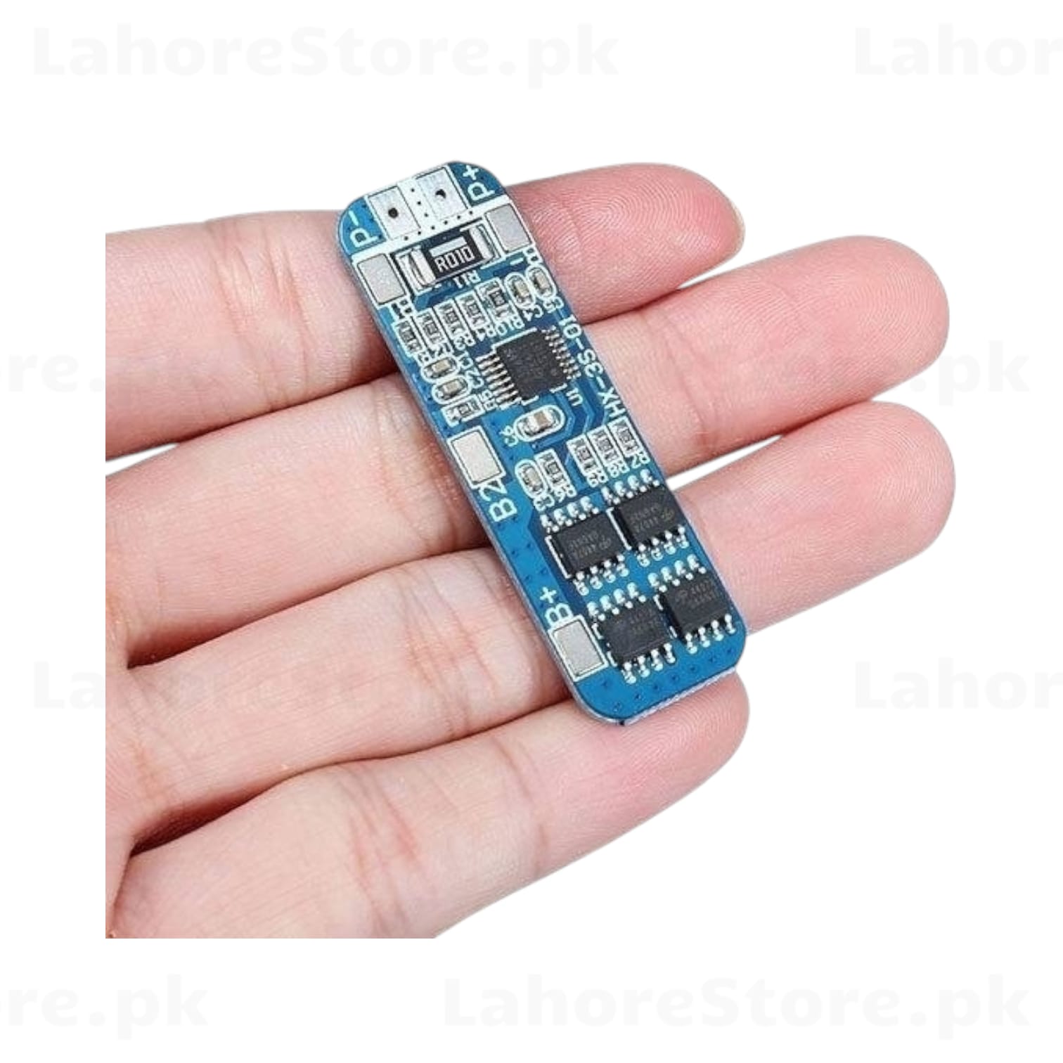HX-3S-01 BMS board held in hand showing compact size