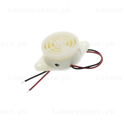 Active piezo buzzer side view showing flanged mounting base and wire leads