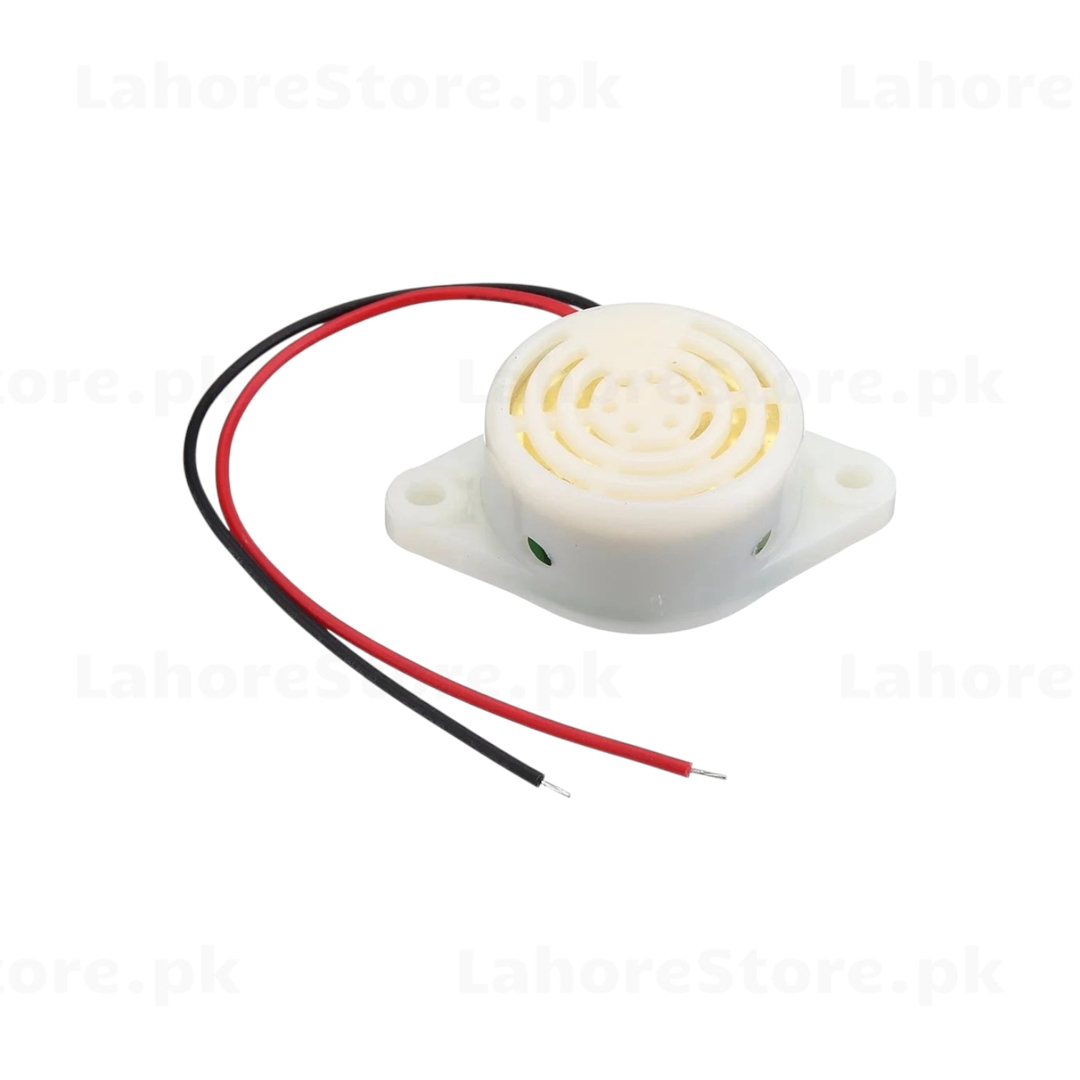 Active piezo buzzer angled view showing green polarity indicator dot and wire leads