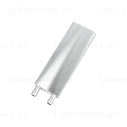 Aluminum water cooling block angled top view showing brushed finish and two barbed hose fittings
