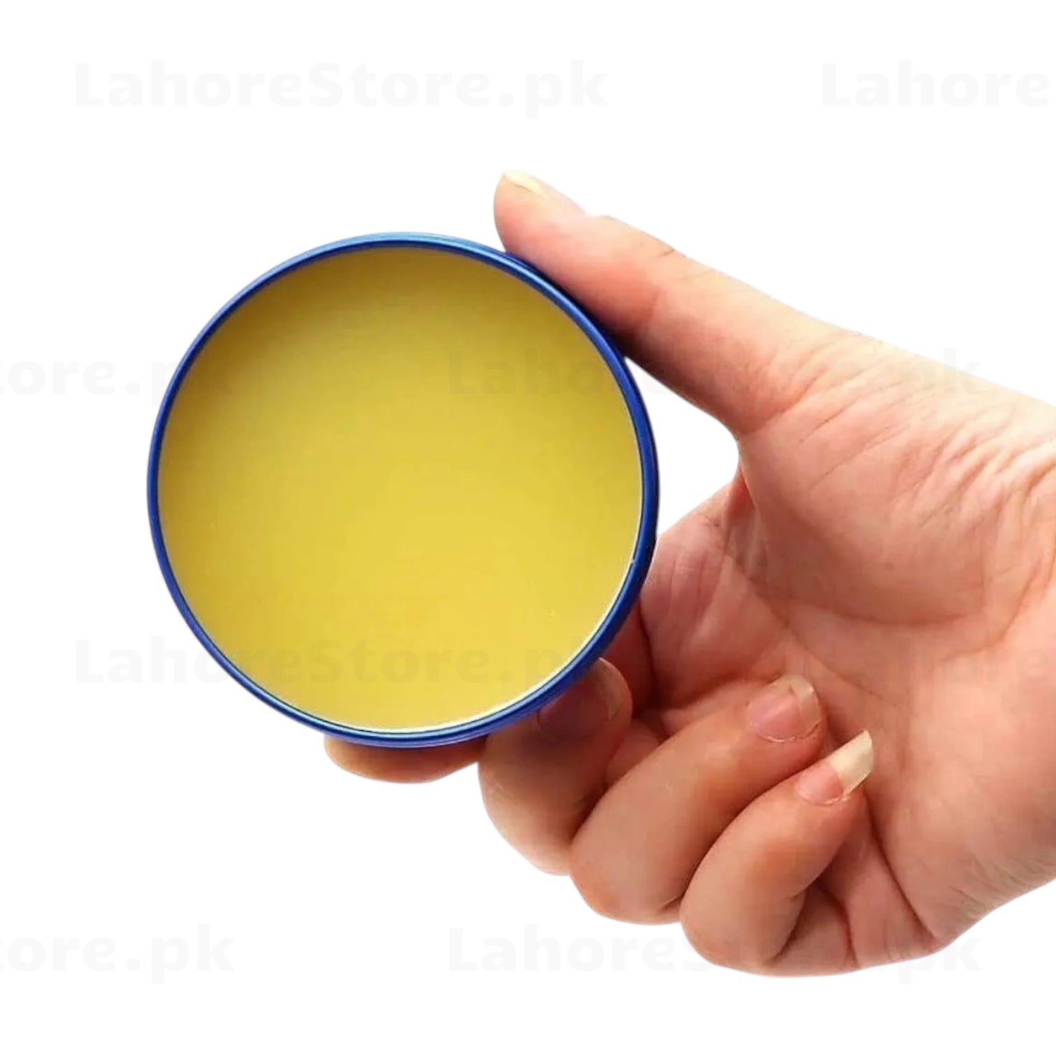 Mechanic UV80 flux paste open tin showing yellow rosin flux held in hand – top view