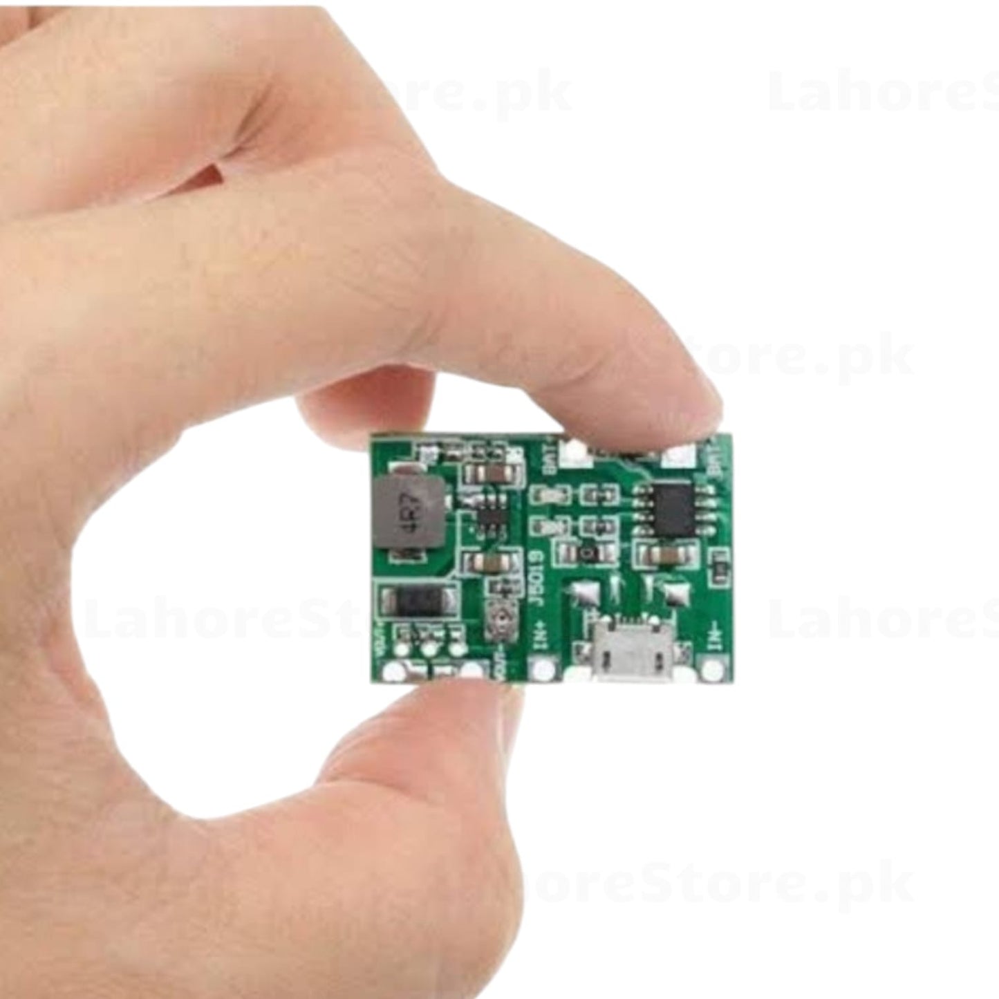 J5019 Li-ion charger boost module held in hand showing top components