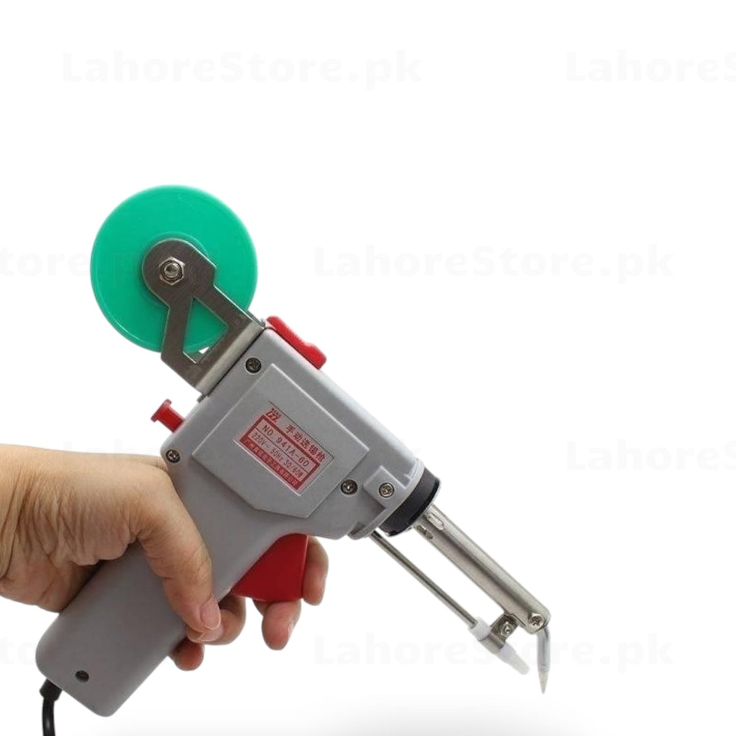 Gaojie 941A-60 soldering iron held in hand showing pistol grip and solder reel