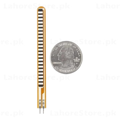 Single Spectra Symbol flex sensor next to a quarter coin for size reference